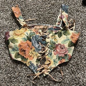 This is a wild fable, corset top. In perfect condition with no rips or tears.